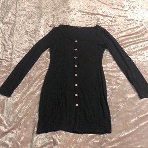 This is a plain black long sleeve medium sized dress. It’s a size L I’m women’s